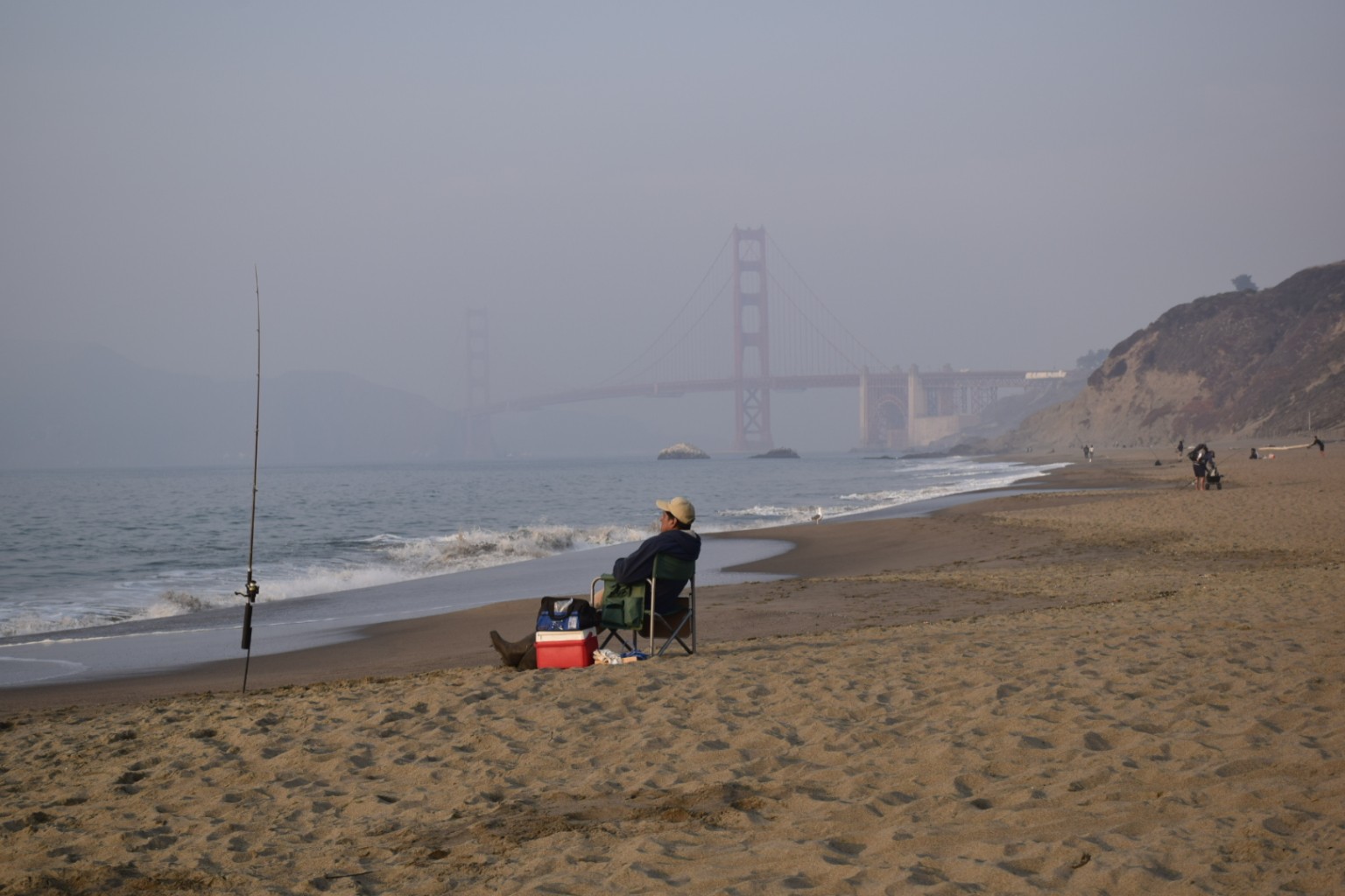 People fishing on the coast