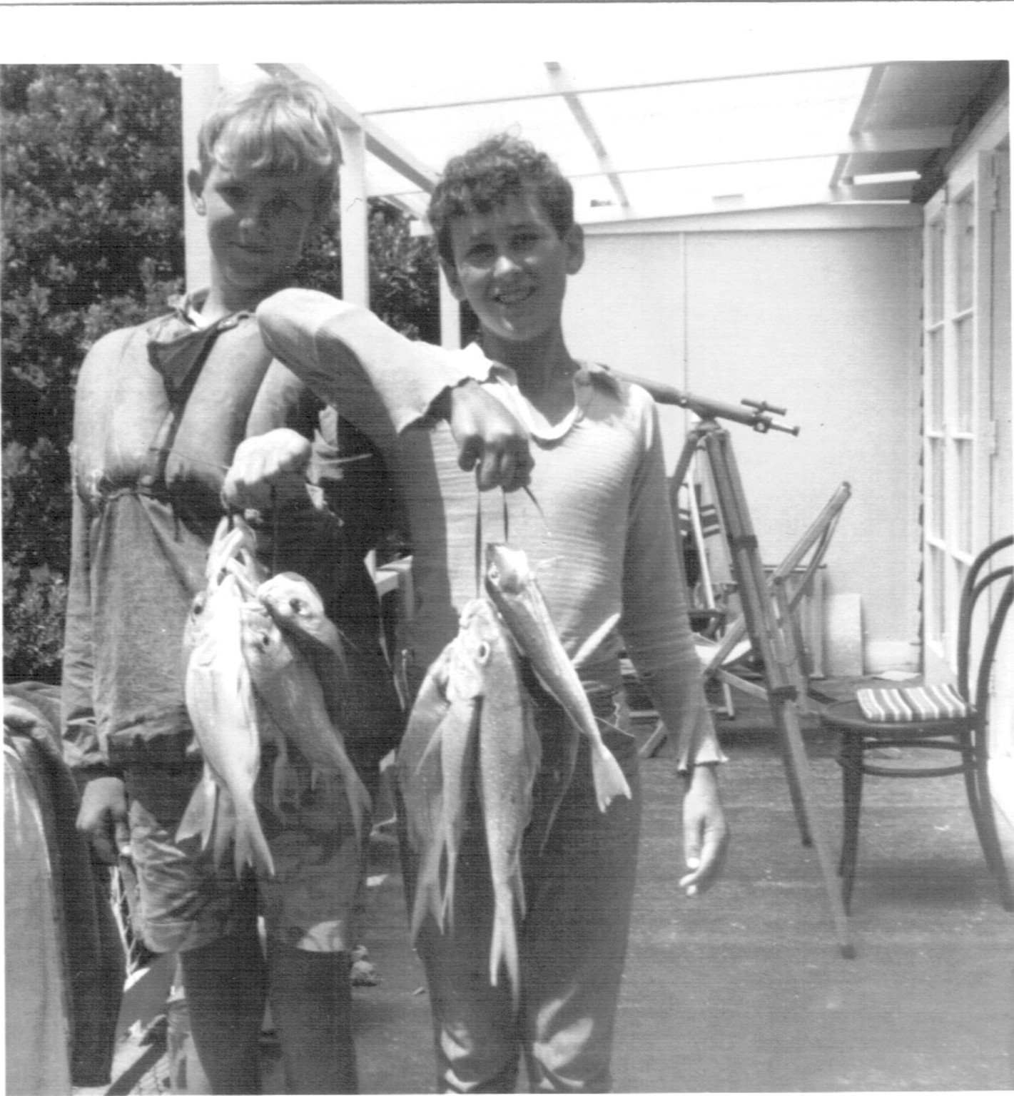 Historic black and white family fishing photo